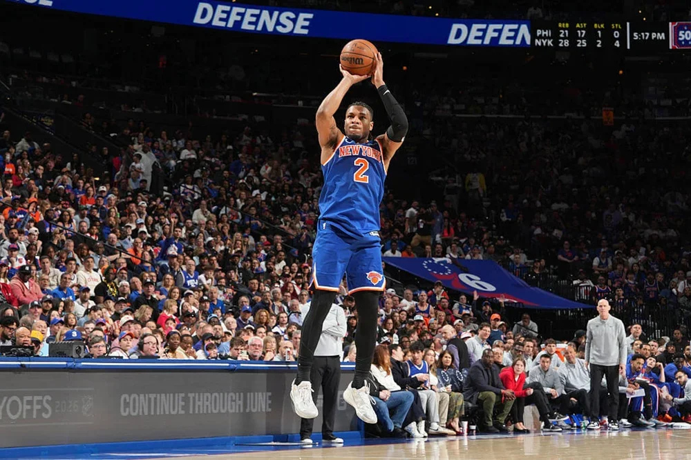 Miles McBride of the New York Knicks shoots a 3-pointer against the Sixers.